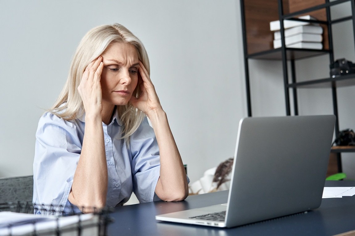 stressed-old-business-woman-suffering-from-headach-2021-09-02-14-46-46-utc
